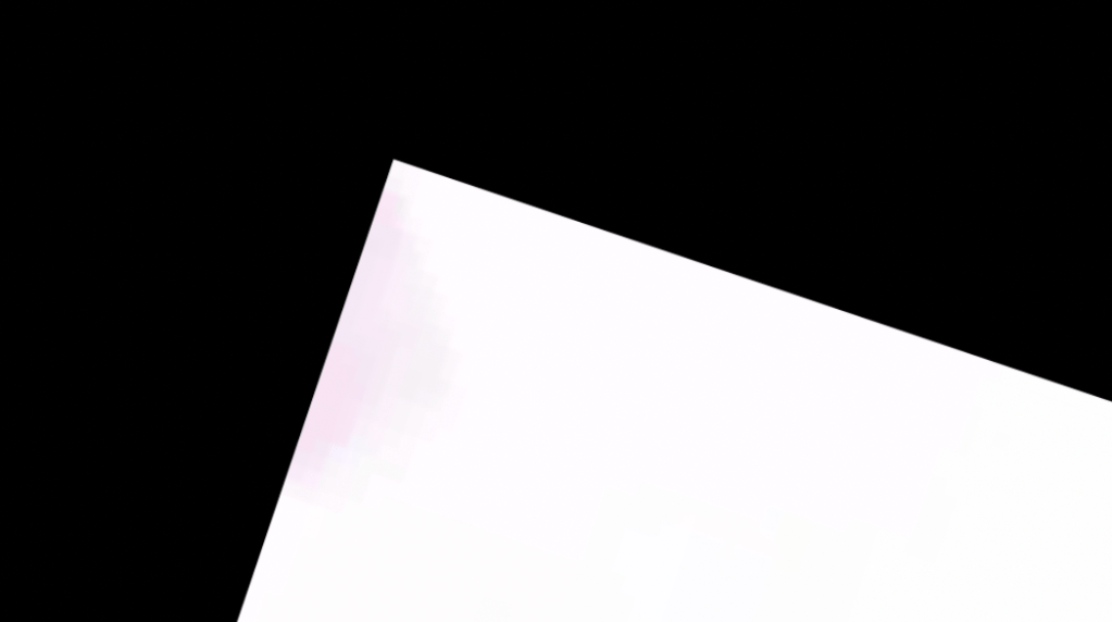 large black mage with a white triangle protruding from the bottom left corner